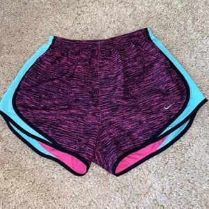 Purple-pink Nike shorts with blue accent